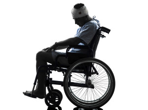 injured man in wheelchair silhouette