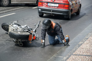 The man fell off a motorcycle Harley Davidson